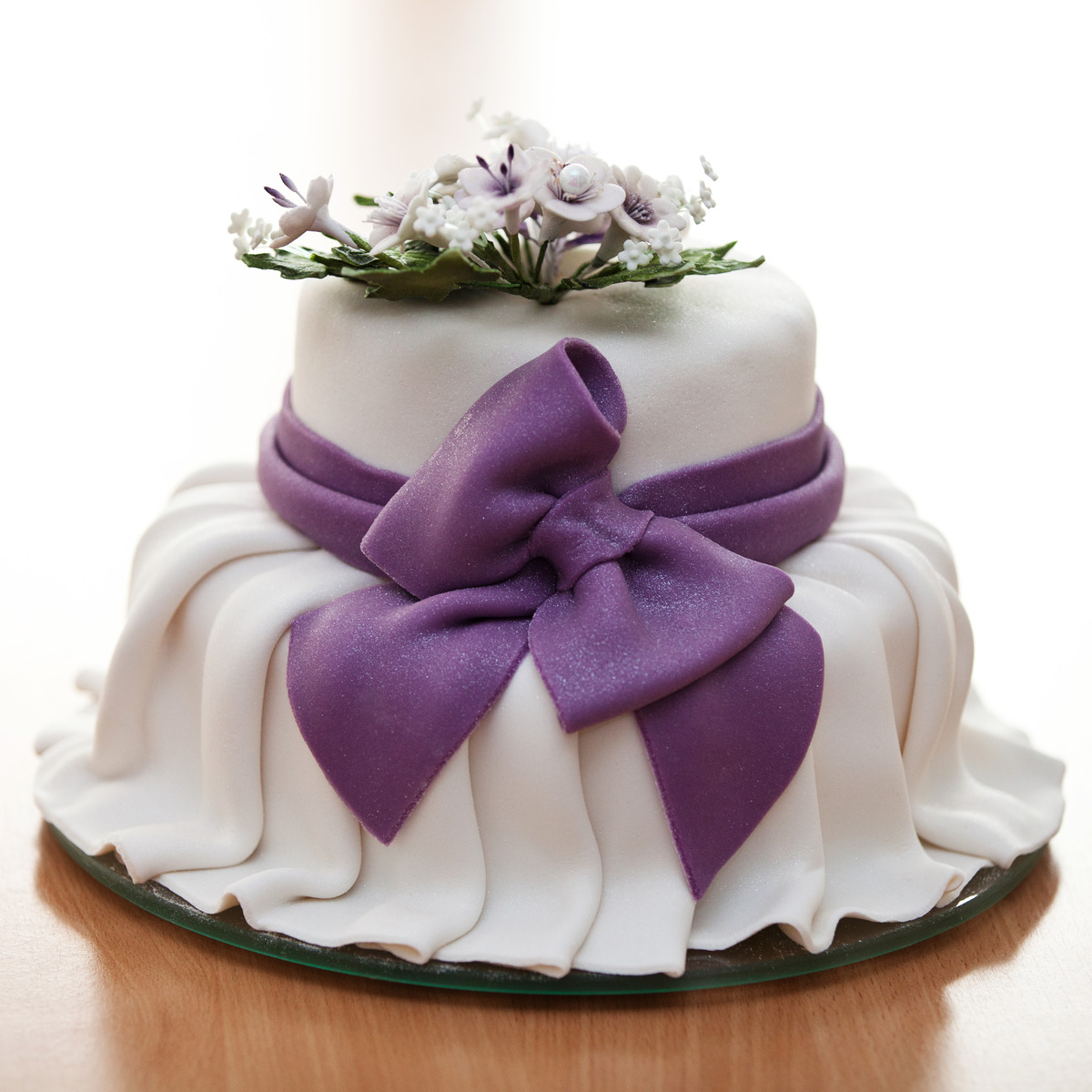 photo of beautiful white cake with purple accents, Unique Cakes